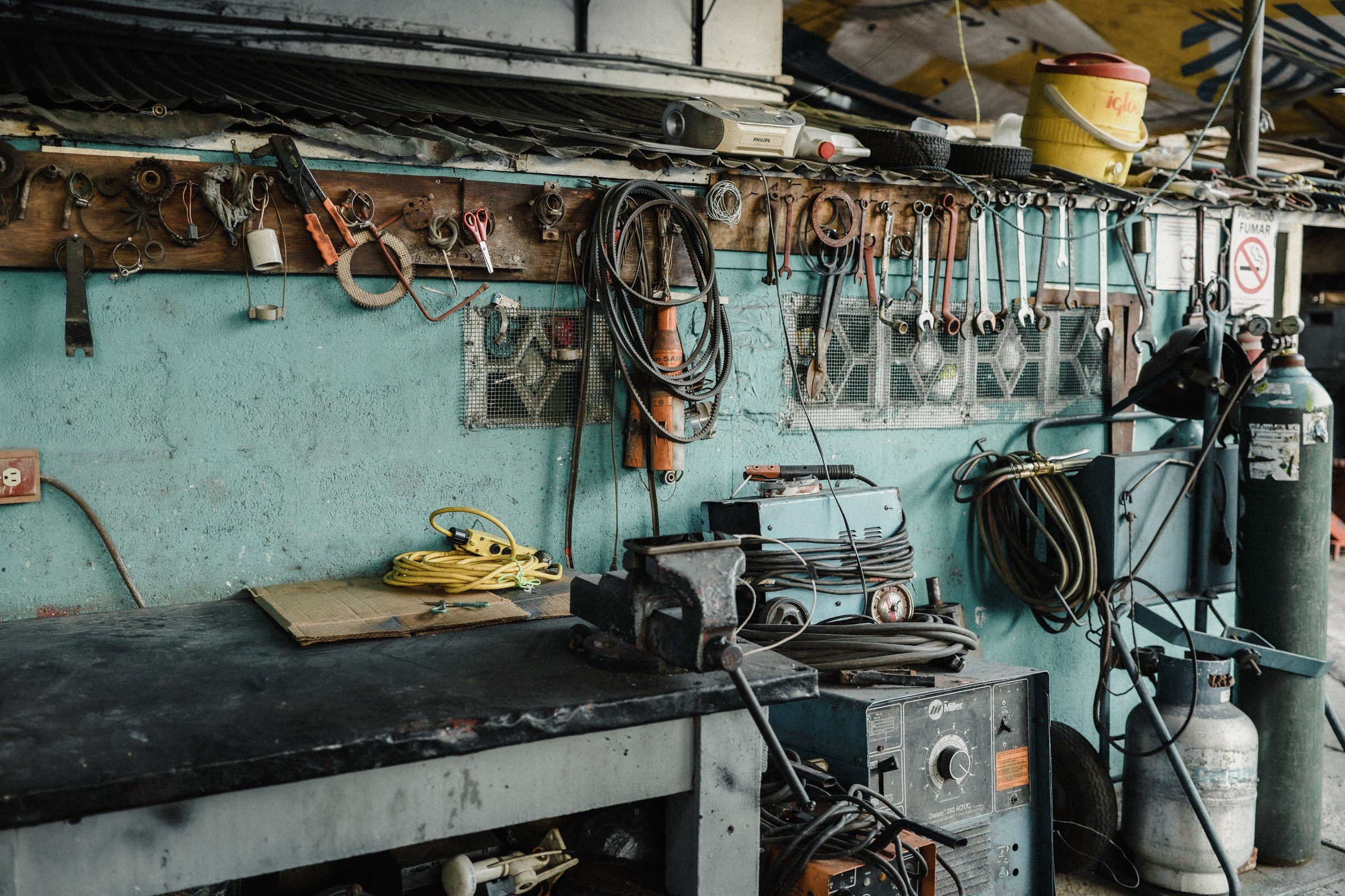 A workshop bench with tools and a vice, illustrating end of service gratuity calculation in the UAE